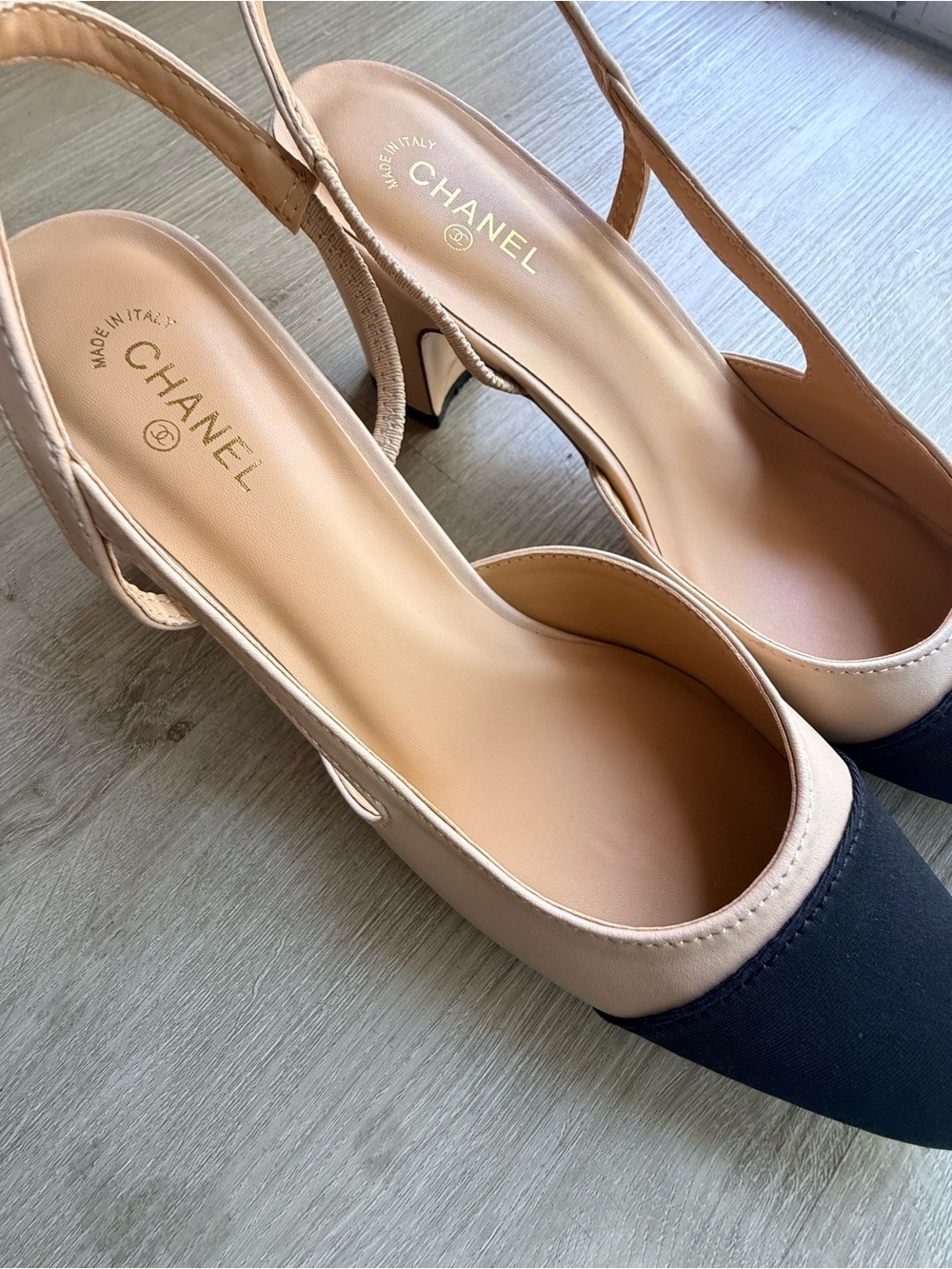 CHANEL Two-Tone Slingback Flats in Black and Beige